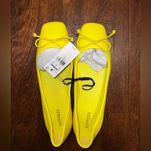 NWT Express ballets flats in a size 8. The color is citron.